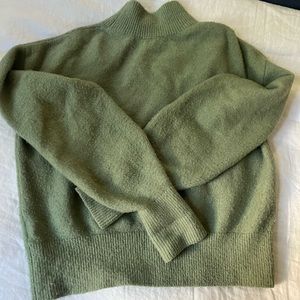 Green turtleneck sweater